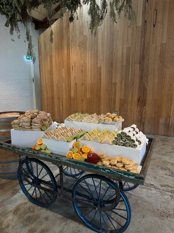 Canapé cart with sandwiches, wraps and fresh fruit at a Melbourne event